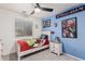 bedroom with a bed, nightstand, and Marvel superhero decor on the walls at 6804 S 45Th Gln, Laveen, AZ 85339