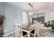 Bright dining room with a wood table and chandelier at 6804 S 45Th Gln, Laveen, AZ 85339