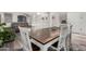 Dining room featuring wood and white table and decor at 6804 S 45Th Gln, Laveen, AZ 85339
