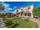 Expansive backyard featuring a gazebo, covered patio, and lush green lawn, offering ample space for outdoor enjoyment at 6804 S 45Th Gln, Laveen, AZ 85339
