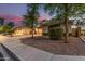 Charming property featuring a well-kept front yard, two-car garage, and separate single car garage at 6804 S 45Th Gln, Laveen, AZ 85339