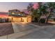 Inviting two-story home showcasing a three-car garage and a neatly landscaped front yard at 6804 S 45Th Gln, Laveen, AZ 85339