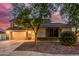 Well-maintained single-Gathering home featuring a spacious driveway and beautiful desert landscaping at 6804 S 45Th Gln, Laveen, AZ 85339