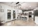 Bright kitchen with white cabinets, stainless steel appliances, and a breakfast bar with seating at 6804 S 45Th Gln, Laveen, AZ 85339