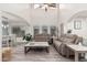 Open concept living room with natural light and wood floors at 6804 S 45Th Gln, Laveen, AZ 85339