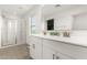 Bathroom boasting a double vanity, a large mirror, and a glass-enclosed shower at 6823 W Getty Dr, Phoenix, AZ 85043