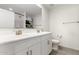 Bright bathroom featuring a double sink vanity, ample mirror space, and tiled floors at 6823 W Getty Dr, Phoenix, AZ 85043