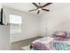 Bright bedroom with a ceiling fan and a window that lets in natural light at 6823 W Getty Dr, Phoenix, AZ 85043