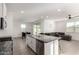 Open kitchen featuring granite countertops, stainless steel appliances, and an island with bar seating at 6823 W Getty Dr, Phoenix, AZ 85043