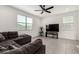 Spacious living room with neutral walls, comfortable seating and entertainment center at 6823 W Getty Dr, Phoenix, AZ 85043