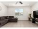 Living room with tile flooring, comfortable seating, and plenty of natural light at 6823 W Getty Dr, Phoenix, AZ 85043
