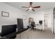 Functional office space with dual desk setup and ceiling fan provides comfort at 6823 W Getty Dr, Phoenix, AZ 85043