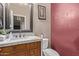 Powder room with ornate mirror, granite countertop and stylish fixtures at 6925 W Maldonado Rd, Laveen, AZ 85339
