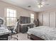 Bedroom featuring neutral walls, a ceiling fan, and windows that provide natural light at 6925 W Maldonado Rd, Laveen, AZ 85339