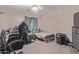 Bedroom featuring neutral walls, a ceiling fan, carpet, and one window with curtains at 6925 W Maldonado Rd, Laveen, AZ 85339