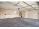Spacious two-car garage features ample storage cabinets at 6925 W Maldonado Rd, Laveen, AZ 85339