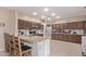 Bright kitchen features stainless appliances, granite countertops, and wood cabinets at 6925 W Maldonado Rd, Laveen, AZ 85339
