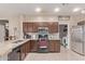 Kitchen featuring stainless steel appliances, granite counters and dark cabinets at 6925 W Maldonado Rd, Laveen, AZ 85339