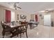 Open concept living area with tile flooring, a pool table, and a dining table at 6925 W Maldonado Rd, Laveen, AZ 85339