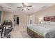 Main bedroom with ensuite bathroom, ceiling fan, walk-in closet and tile floors at 6925 W Maldonado Rd, Laveen, AZ 85339