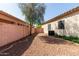 A beautiful backyard featuring a tree and a gravel landscape design for low maintenance at 6970 W Paso Trl, Peoria, AZ 85383