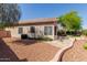 Private backyard featuring mature trees, low-maintenance landscaping and block fence at 6970 W Paso Trl, Peoria, AZ 85383