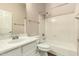 Well-lit bathroom featuring a white vanity, toilet, and shower-tub combination at 6970 W Paso Trl, Peoria, AZ 85383