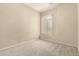 Bright bedroom with neutral walls, carpet, and a window with adjustable blinds at 6970 W Paso Trl, Peoria, AZ 85383