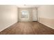Bright living room boasts stylish wood floors and a sunny window at 6970 W Paso Trl, Peoria, AZ 85383