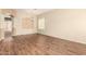 Bright living room boasts stylish wood floors and a contemporary light fixture at 6970 W Paso Trl, Peoria, AZ 85383