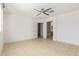 Bright bedroom with tiled floors, ceiling fan, and an ensuite bathroom at 7359 W Rancho Dr, Glendale, AZ 85303