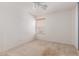 A bedroom featuring a ceiling fan and a window with blinds at 7359 W Rancho Dr, Glendale, AZ 85303