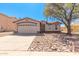 Inviting single-Gathering home with a two-car garage and desert-friendly landscaping at 7359 W Rancho Dr, Glendale, AZ 85303