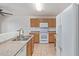 Traditional kitchen with tile floors, white appliances, and plenty of cabinet space at 7359 W Rancho Dr, Glendale, AZ 85303