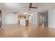 Open-concept living space with tiled floors and a ceiling fan at 7359 W Rancho Dr, Glendale, AZ 85303
