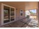 Covered patio featuring sliding glass doors for seamless indoor-outdoor living at 7359 W Rancho Dr, Glendale, AZ 85303