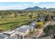 Stunning aerial view of the community, golf course, and mountain views creates a tranquil setting at 7939 E Via Linda --, Scottsdale, AZ 85258