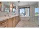 Bathroom with double vanity, soaking tub, and walk-in shower with natural light at 7939 E Via Linda --, Scottsdale, AZ 85258
