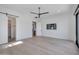 Bright bedroom with plenty of space, ceiling fan, TV, and large door leading to another room at 7939 E Via Linda --, Scottsdale, AZ 85258