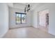 Bright dining room with large window and hardwood floors with access to other rooms at 7939 E Via Linda --, Scottsdale, AZ 85258