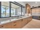 Kitchen features long countertop, wood cabinets and large window view of the backyard and pool at 7939 E Via Linda --, Scottsdale, AZ 85258