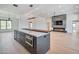 Modern kitchen with a large island, sleek gray cabinets, and stainless steel appliances at 7939 E Via Linda --, Scottsdale, AZ 85258