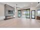 Spacious living room has a fireplace and large sliding doors to the backyard and pool at 7939 E Via Linda --, Scottsdale, AZ 85258