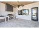 Covered outdoor kitchen features a stainless steel grill, beverage center, ample counter space, and tile flooring at 7939 E Via Linda --, Scottsdale, AZ 85258