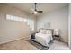 Serene bedroom with shuttered windows, modern ceiling fan and a stylish area rug at 902 W Glendale Ave # 115, Phoenix, AZ 85021
