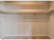 Empty closet with neutral carpeting and painted walls and shelves ready for all of your storage needs at 902 W Glendale Ave # 115, Phoenix, AZ 85021