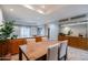 The dining room features a wooden table with upholstered chairs, recessed lighting, and wood cabinetry at 902 W Glendale Ave # 115, Phoenix, AZ 85021