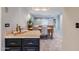 The dining room is situated adjacent to the kitchen with an open serving bar and light-filled windows at 902 W Glendale Ave # 115, Phoenix, AZ 85021