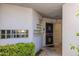 Condo front door with glass block windows and desert landscaping at 902 W Glendale Ave # 115, Phoenix, AZ 85021