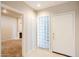 Bright condo entryway with glass block windows and a white front door at 902 W Glendale Ave # 115, Phoenix, AZ 85021